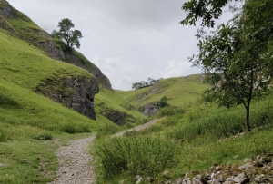 Looking up Cave Dale with it's limestone outcrops and sheep grazed embankements