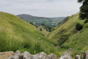 Looking down Cave Dale with Peveril Castle in the midground and Lose Hill in the background