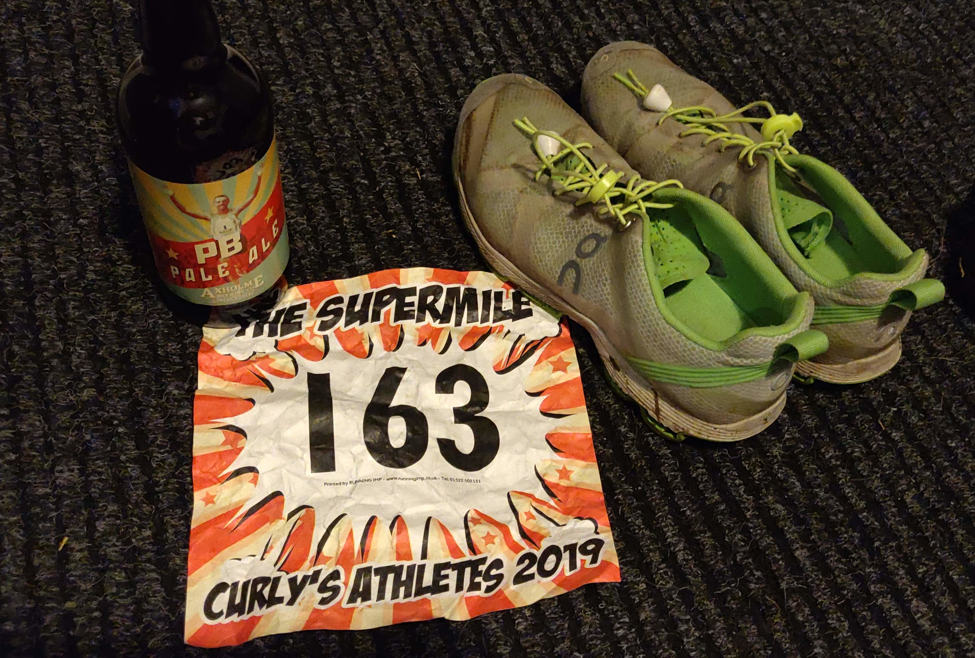 PB pale ales, race number and my Cloud trainers after the Supermile